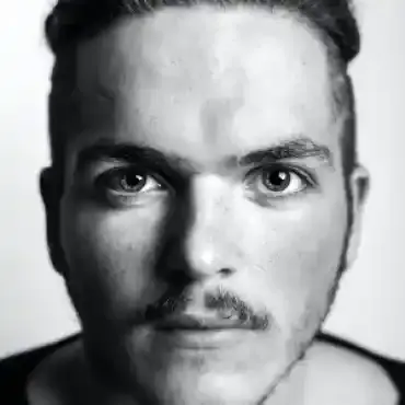 Albert Flores posing on a dock with a trophy from a Fishing Club Canada walleye competition