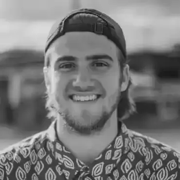 Devon Lane holding a stringer of fish during a Fishing Club Canada family event